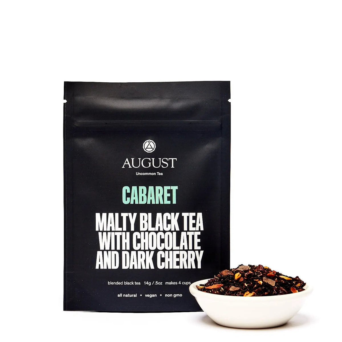 Cabaret cherry chocolate black tea pack with dry tea leaves in a bowl, highlighting malty flavor and rich aroma.