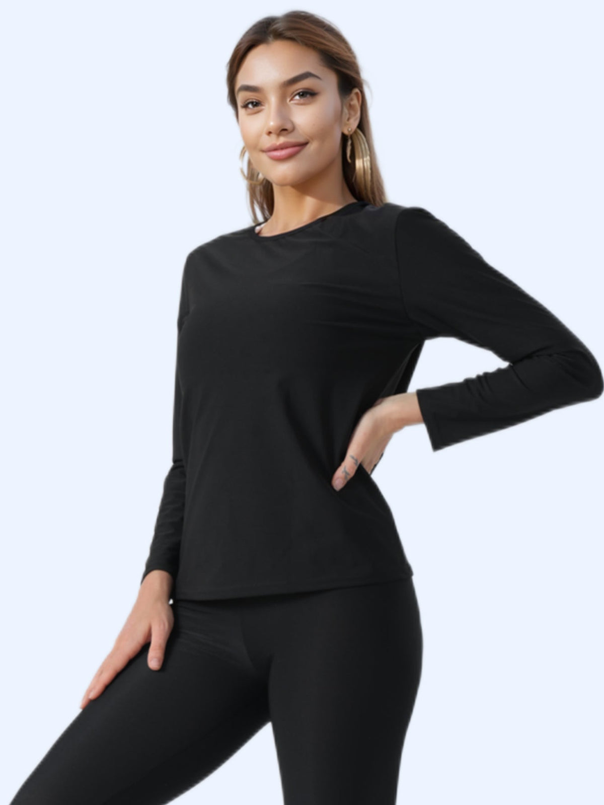 Sauna sweat suit women long sleeve black top worn by model showcasing workout fashion.