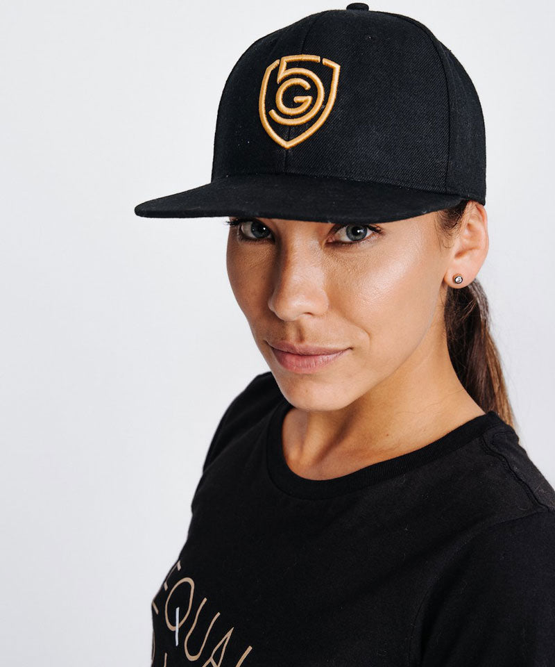 G5 Flat Billed Snap Back Hat worn by a model, featuring a black wool acrylic blend with stylish logo.