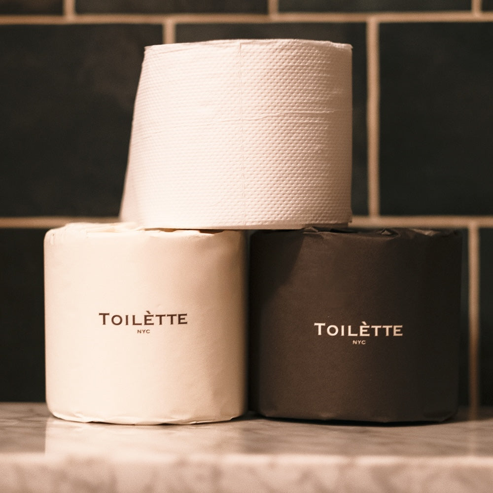 Premium bamboo toilet paper rolls in mixed colors, FSC-certified, tree-free, soft and chemical-free for luxury bathroom experience.