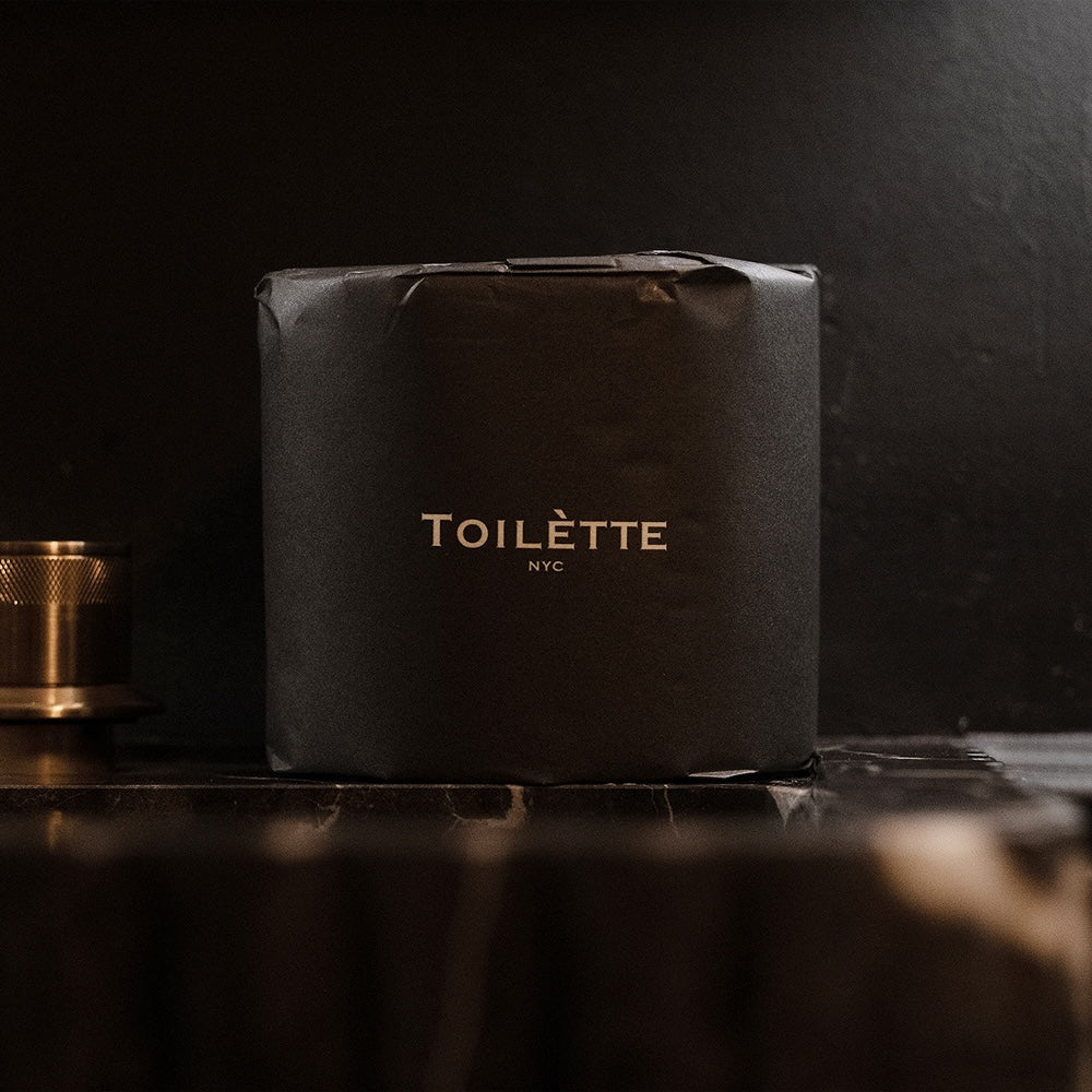 Dark premium bamboo toilet paper roll by Toilètte, eco-friendly and luxuriously soft for a bathroom upgrade.