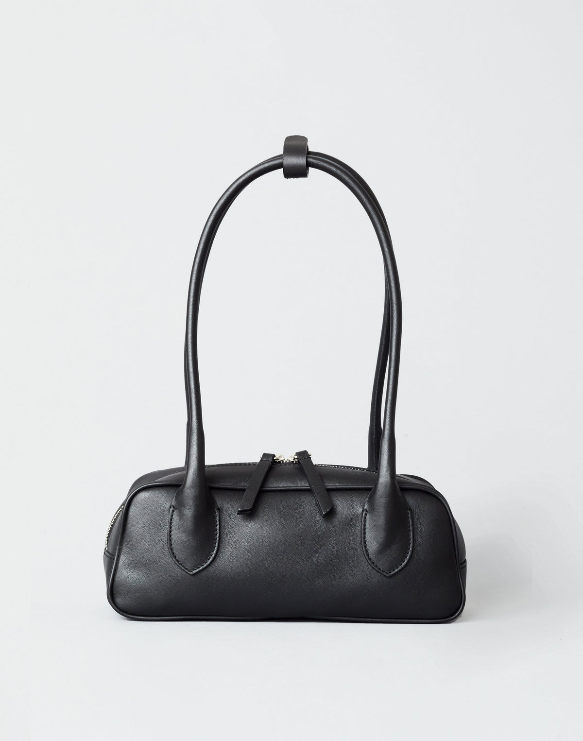 Mini La Strada structured leather baguette bag in black with double-zip closure and flattering strap drop.