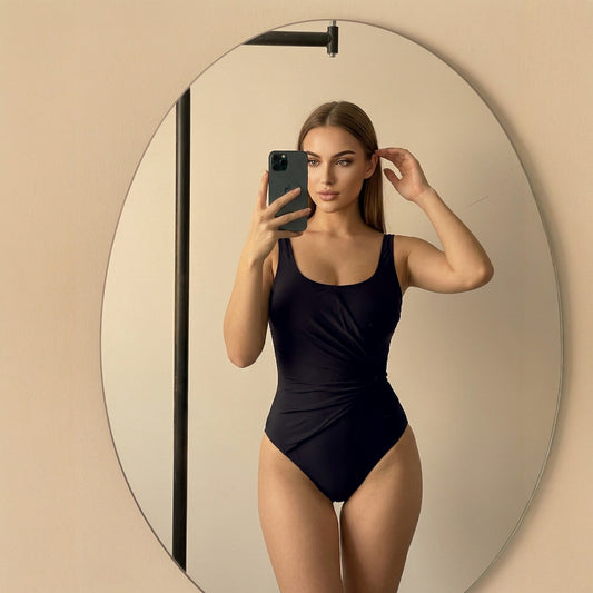 One piece bathing suit tummy control model in black, showcasing elegant design and flattering fit.