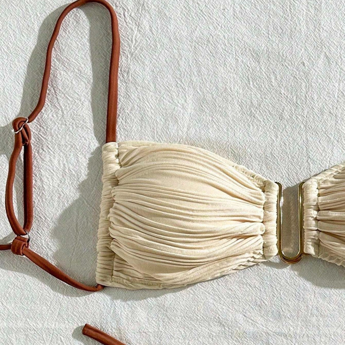 Alt Tag: three-piece sexy swimsuit for women - stylish beige bikini top with brown straps.