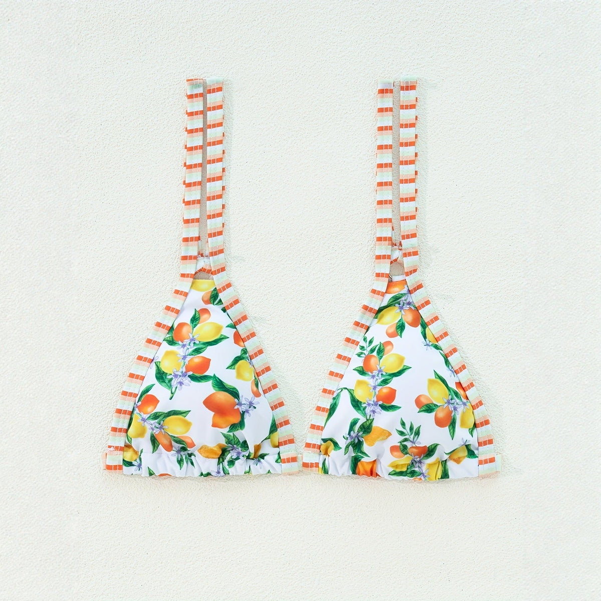 Sexy printed bikini swimsuit set featuring a triangle top with a floral design and striped straps.