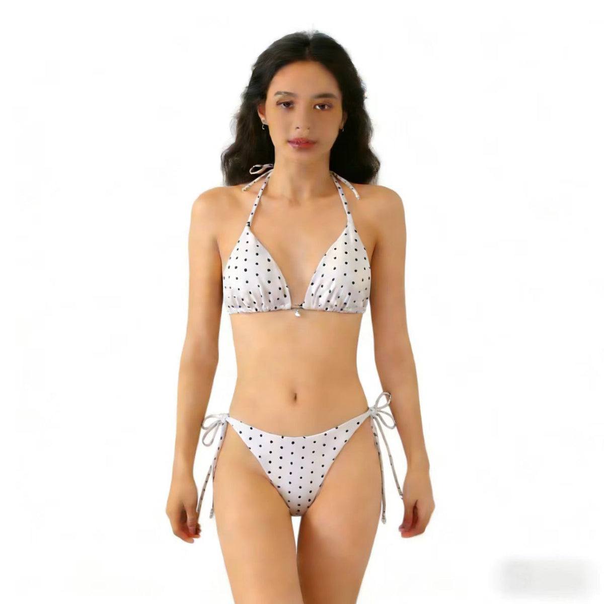 Model wearing multicolor polka dot bikini swimsuit featuring triangle separated straps, perfect for beach wear.