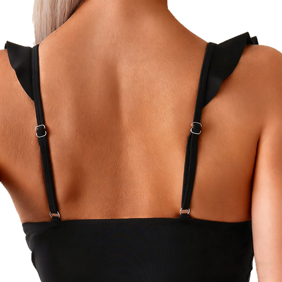 Back view of a woman wearing a sexy ruffled bikini two piece with stylish straps and ruffle details.