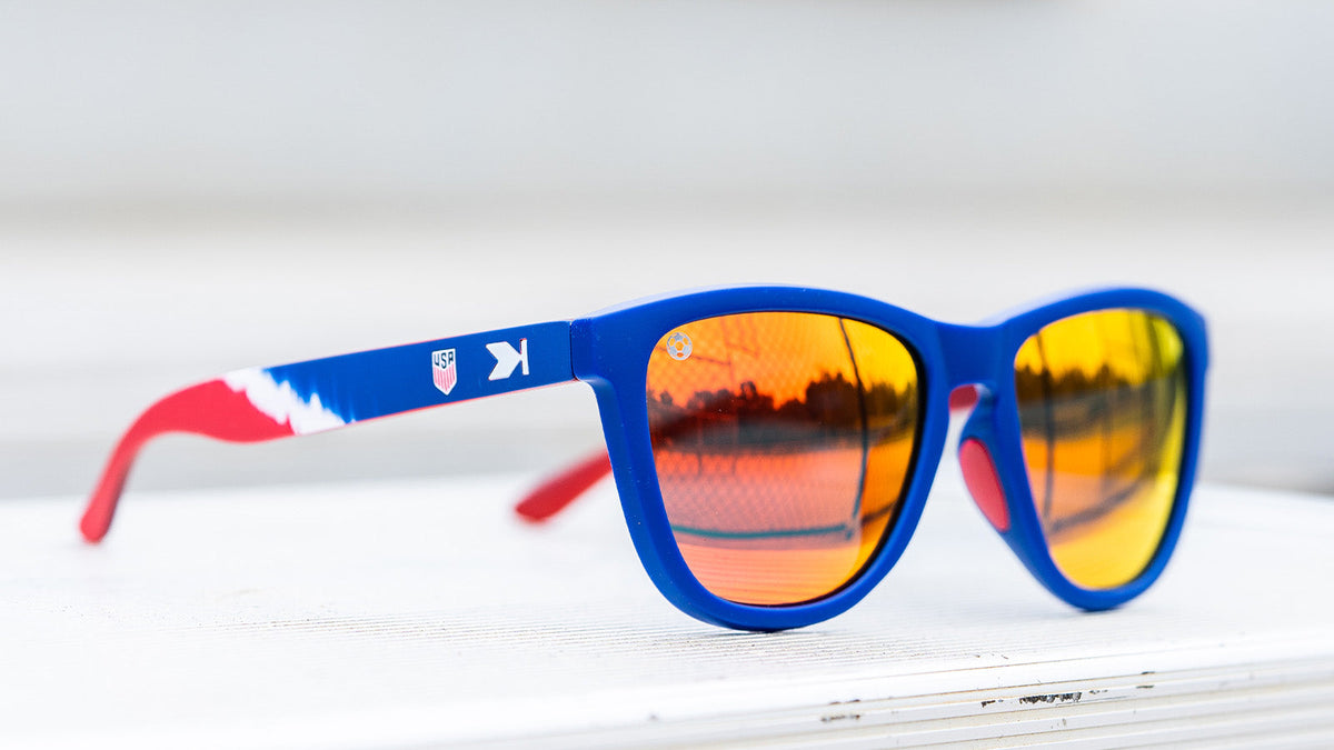 U.S. Soccer 2024 Knockaround Sunglasses featuring tie-dye sash design and reflective lenses.