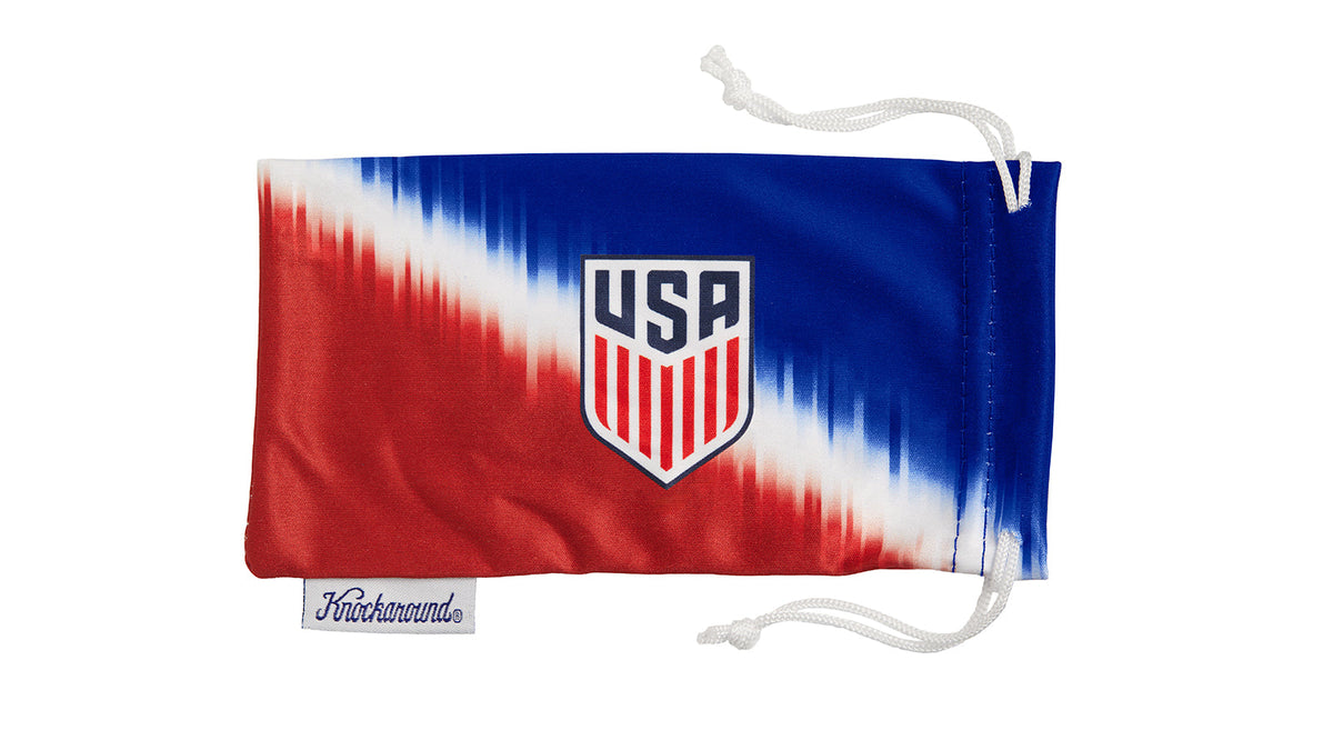 U.S. Soccer 2024 Knockaround Sunglasses protective pouch with USA logo in tie-dye design.