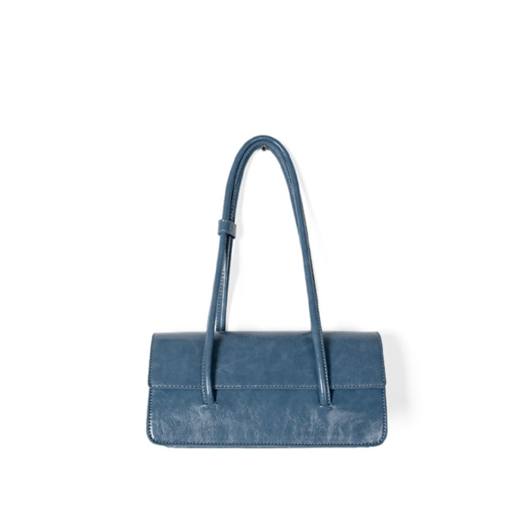 Stylish oil wax leather shoulder tote bag in blue with dual handles, perfect for any occasion.