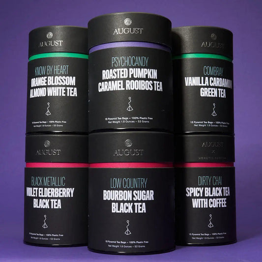 All the August tea bag flavors including black, green, and herbal varieties displayed in stylish packaging.
